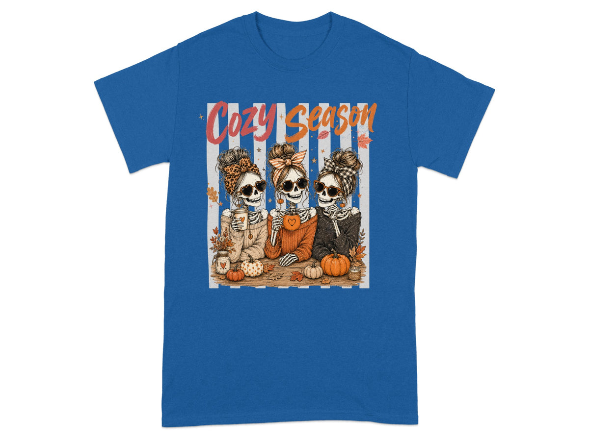 Three skeletons with sunglasses and headbands saying "Cozy Season".