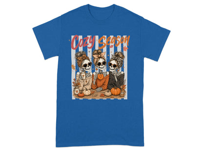 Three skeletons with sunglasses and headbands saying "Cozy Season".
