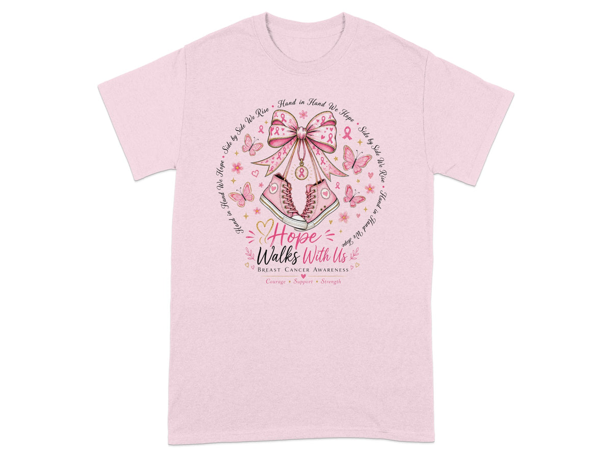 Pink t-shirt with breast cancer awareness graphic featuring sneakers, ribbons, and text.