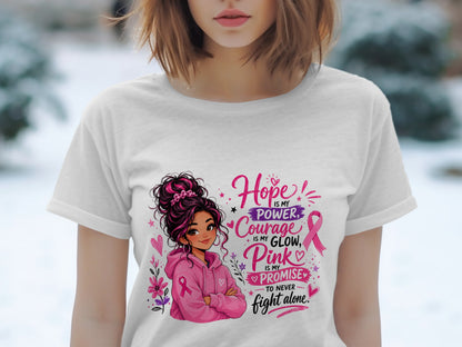 White t-shirt with illustration of girl and text "Hope is my Power, Courage is my Glow, Pink is my Promise to Never Fight Alone."