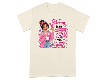 Woman holding pink ribbon with text "Strong in spirit, soft in heart, pink for hope, art for healing".