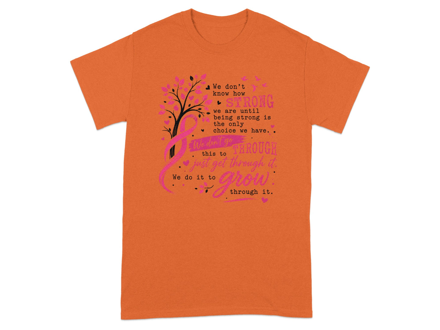 Orange t-shirt with pink tree, ribbon, and text about strength and growth.