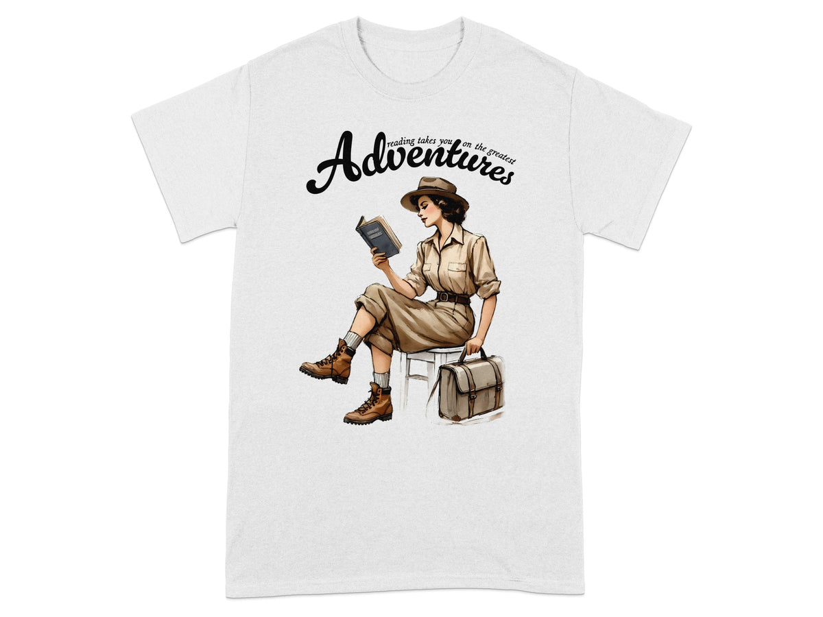 T-shirt with illustration of woman reading book, "Adventures" text, and suitcase.