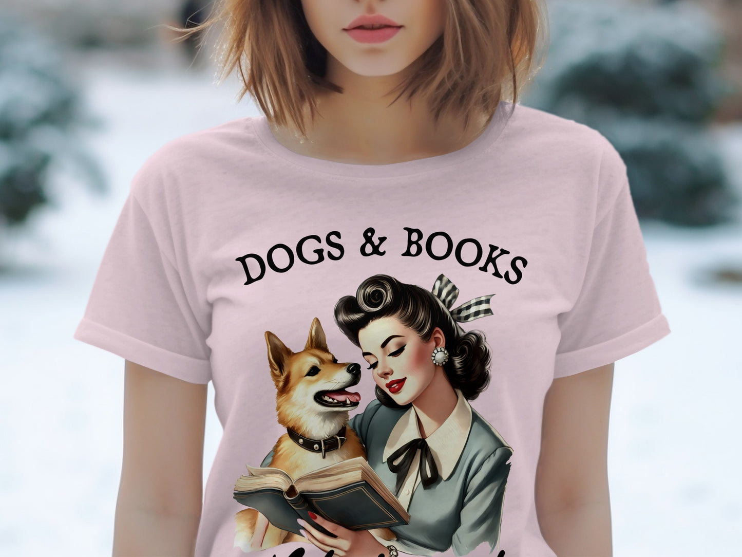 Pink t-shirt with "DOGS & BOOKS" text and vintage woman reading to dog.