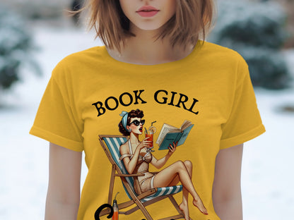 Yellow t-shirt with "BOOK GIRL" text and pin-up style illustration of a woman reading.