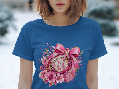 Football adorned with pink ribbons and flowers, tied with a pink bow.
