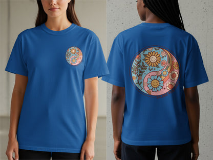 Blue t-shirt with yin-yang floral design and text "BALANCE OVER HUSTLE".