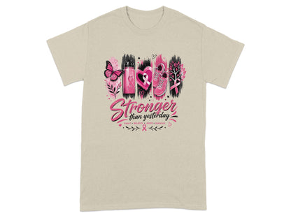 T-shirt with "Stronger than yesterday" text and breast cancer awareness graphics.