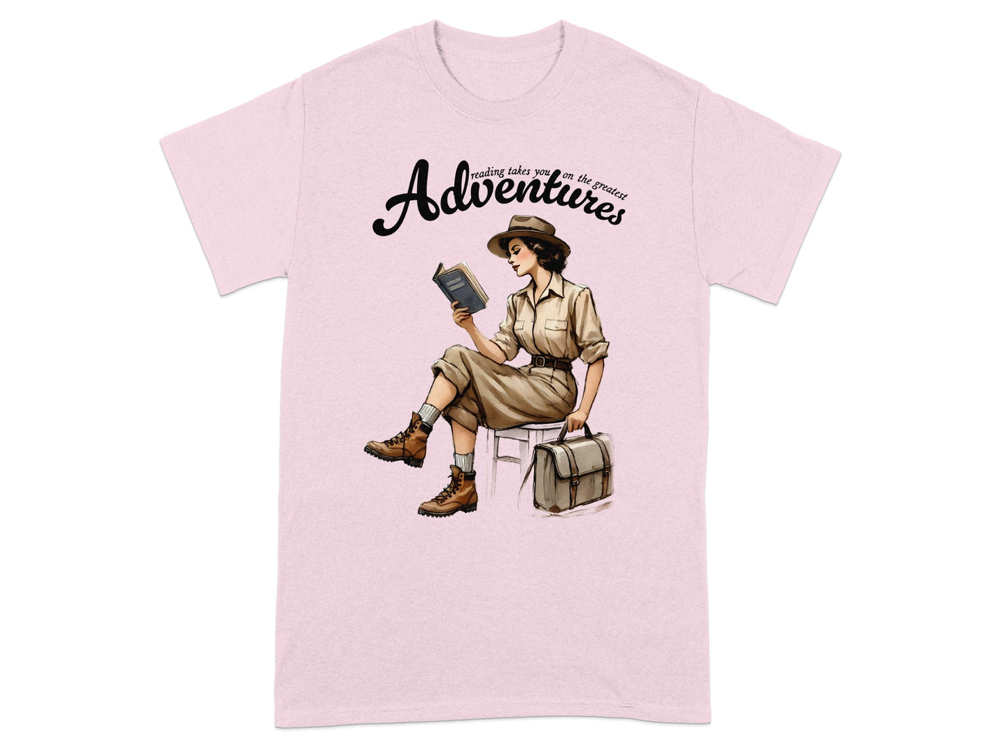 Pink t-shirt with a woman reading and "Adventures" text.