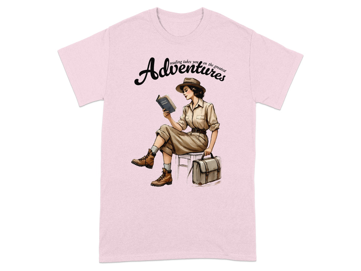 Pink t-shirt with a woman reading and "Adventures" text.