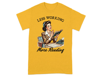 Yellow t-shirt with graphic: woman reading at a desk, text "Less Working More Reading".