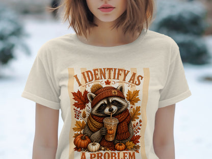 Raccoon wearing a scarf and hat, holding a drink, with autumn leaves and pumpkins.