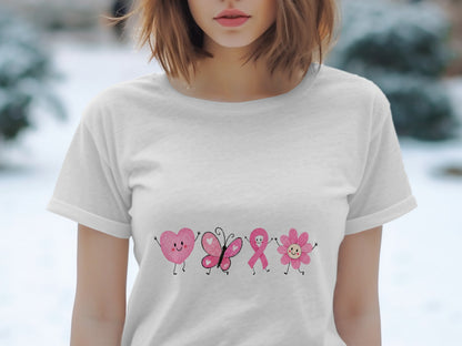 White t-shirt with a cartoon pink heart, butterfly, ribbon, and flower.
