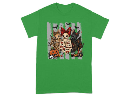 Three cartoon bats with Halloween themes, a pumpkin, and skulls on a green t-shirt.