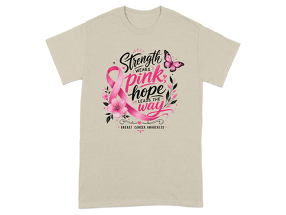 Light beige t-shirt with "Strength wears pink hope leads the way" text and pink ribbon.