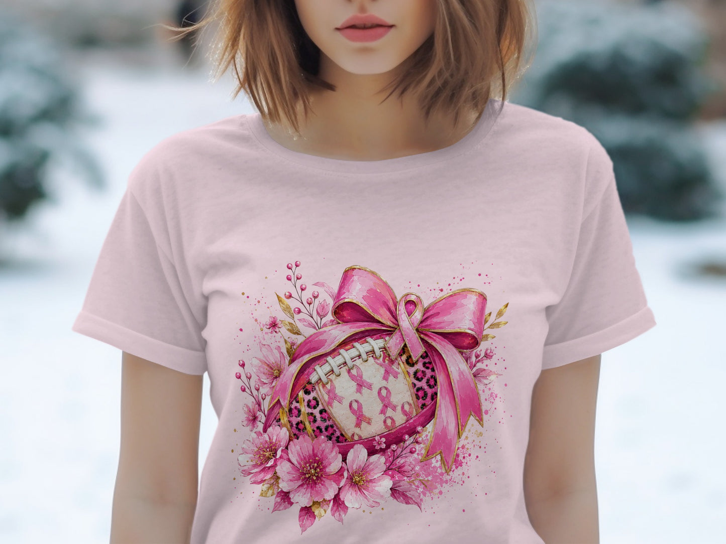 Pink football with pink ribbons and flowers, tied with a large pink bow.