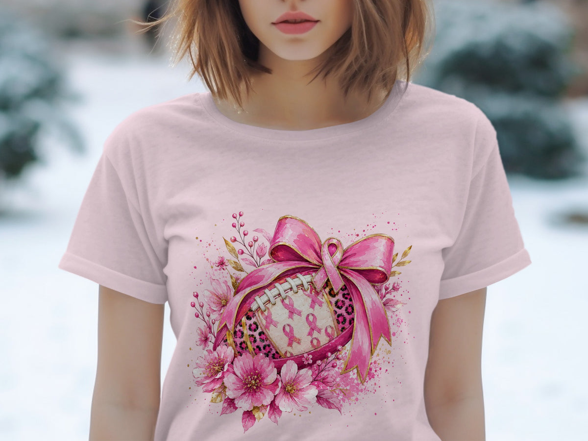 Pink football with pink ribbons and flowers, tied with a large pink bow.