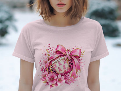 Pink football with pink ribbons and flowers, tied with a large pink bow.