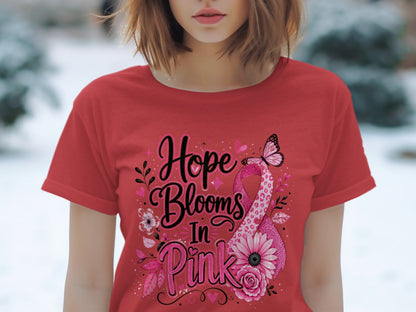 Red t-shirt with pink ribbon design and text "Hope Blooms In Pink"