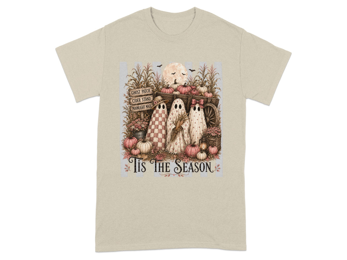 Three ghosts stand by a wagon of pumpkins with corn stalks and the text "Tis The Season".