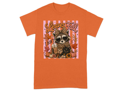 Raccoon with heart sunglasses and cat with "Leaves Fall" text, surrounded by pumpkins.