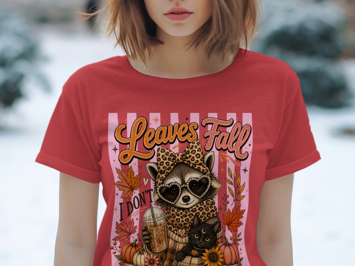 Red t-shirt with raccoon, cat, coffee, and "Leaves Fall" text graphic.