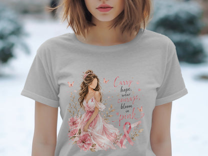 Gray t-shirt with a graphic of a woman in a pink dress and text: Carry hope, wear courage, bloom in pink.