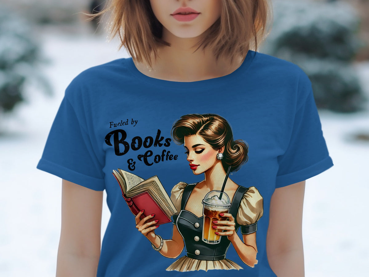 Blue t-shirt with "Fueled by Books & Coffee" and a woman reading with iced coffee.