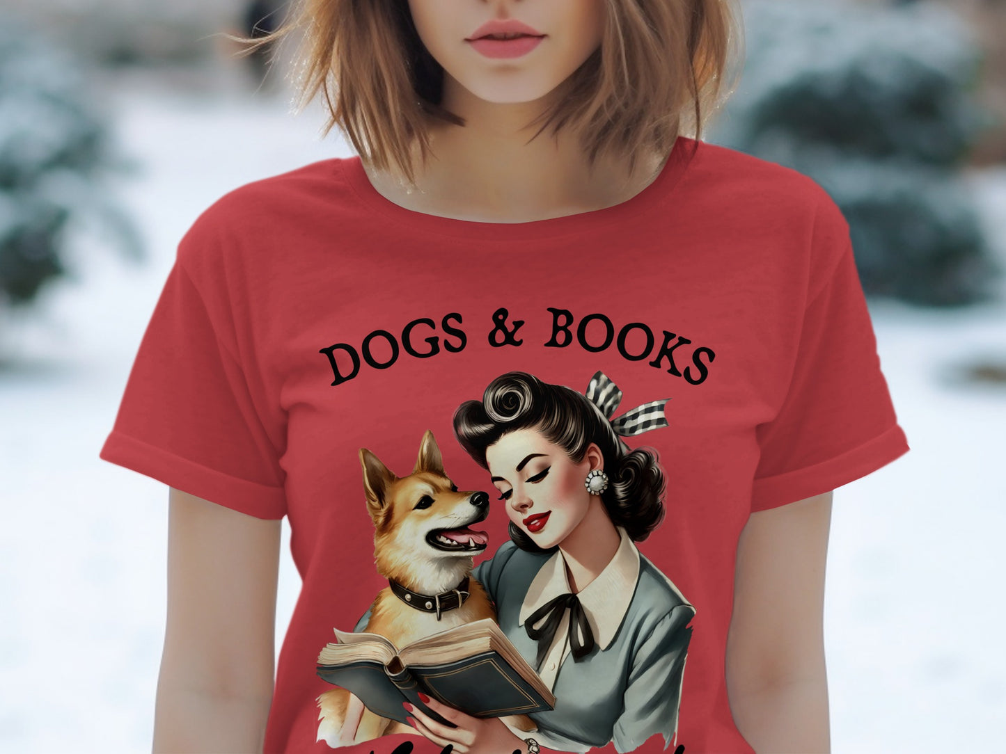 Red t-shirt with "DOGS & BOOKS" text and retro illustration of woman with dog reading book.