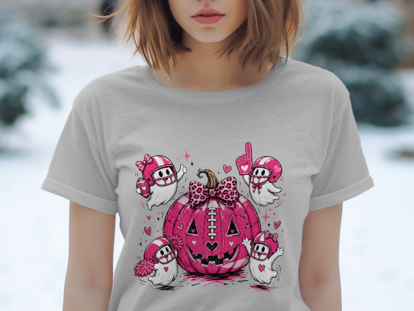 Pink football pumpkin surrounded by cheering ghosts in helmets and football gear.