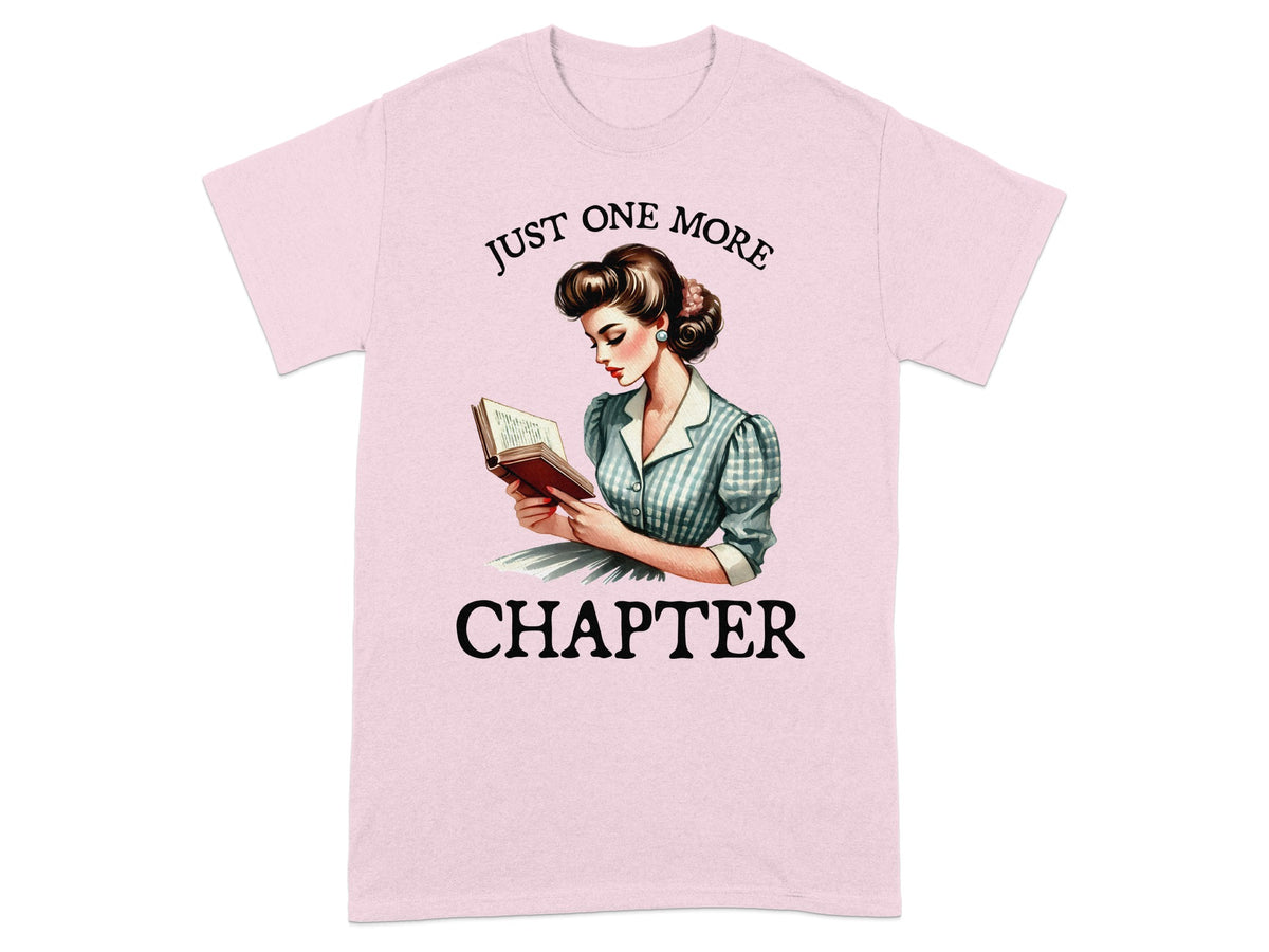 Pink t-shirt with retro illustration of woman reading, "Just one more chapter."