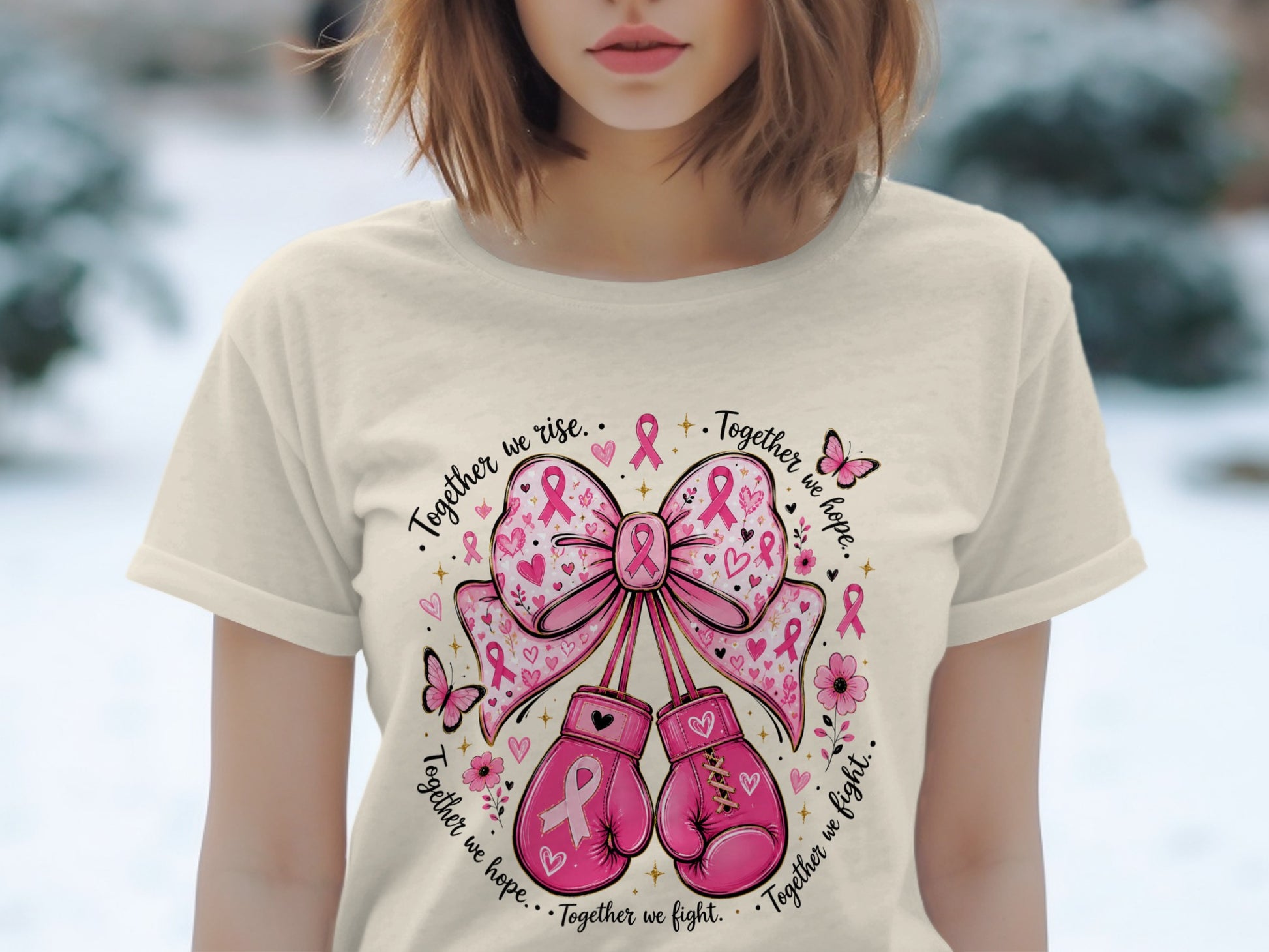 Pink boxing gloves and a bow with breast cancer ribbons and text.