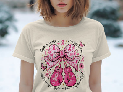 Pink boxing gloves and a bow with breast cancer ribbons and text.