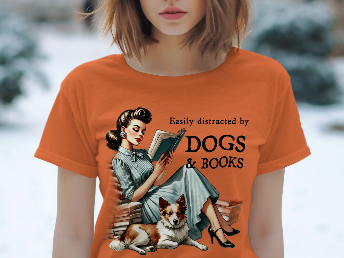 T-shirt graphic with retro woman, dog, and text: "Easily distracted by DOGS & BOOKS".