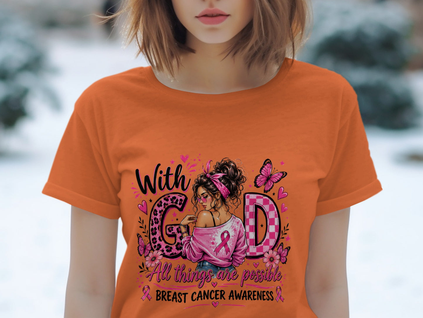 Orange t-shirt with "With God" and breast cancer awareness graphics.