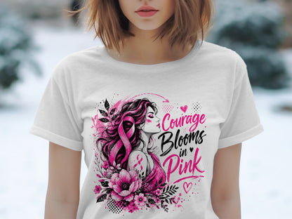 White t-shirt with "Courage Blooms in Pink" graphic featuring a woman with a pink ribbon.