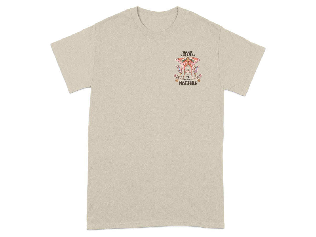 Beige t-shirt with "The way you speak to yourself matters" text and butterfly graphic.
