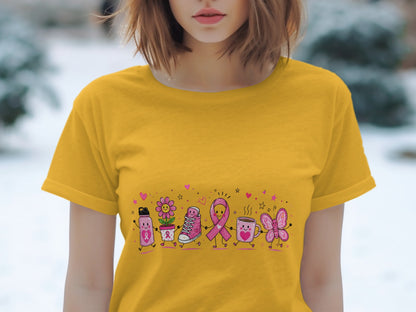 Yellow t-shirt with cartoon breast cancer awareness ribbon characters holding hands.