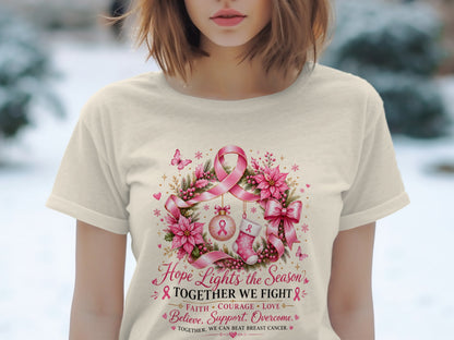 T-shirt with pink ribbon wreath and text "Hope Lights the Season' Together We Fight".