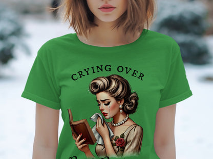 Green t-shirt with crying retro woman reading a book and text "CRYING OVER".