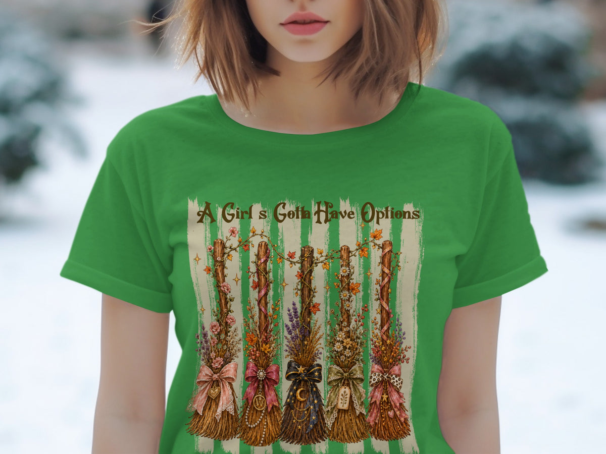Green t-shirt with "A Girl's Gotta Have Options" and five decorative brooms.