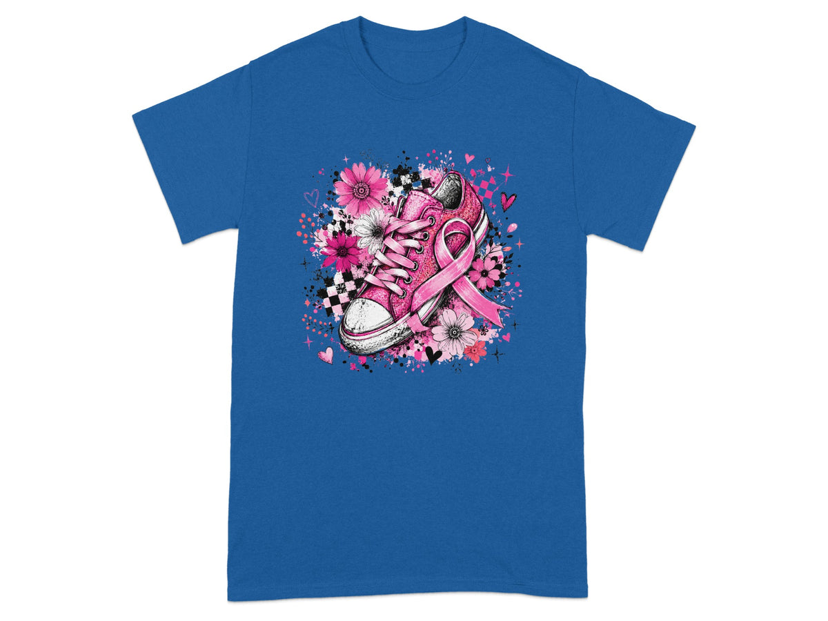 Pink Converse shoe with breast cancer ribbon and floral design on blue t-shirt.