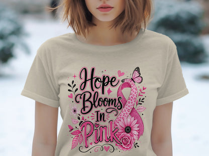 T-shirt with "Hope Blooms In Pink" text and pink ribbon with flowers and butterfly.