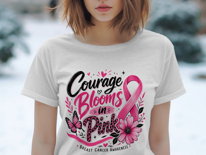 White t-shirt with "Courage Blooms in Pink" and butterfly, flower, breast cancer ribbon graphics.