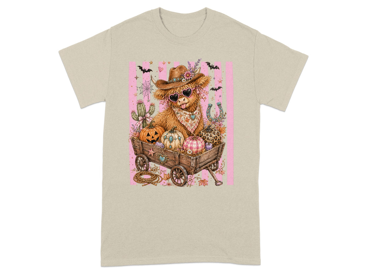 Cowboy Highland cow in wagon with pumpkins, cactus, and horseshoe graphic.