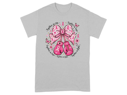 Pink boxing gloves, bow, and breast cancer ribbons with text "Together we rise. Together we hope. Together we fight."