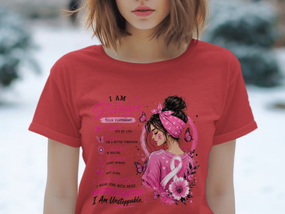 T-shirt with a woman and text about being stronger, a warrior, and unstoppable.