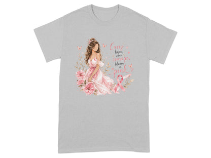T-shirt with woman in pink dress, flowers, butterflies, and text about breast cancer awareness.