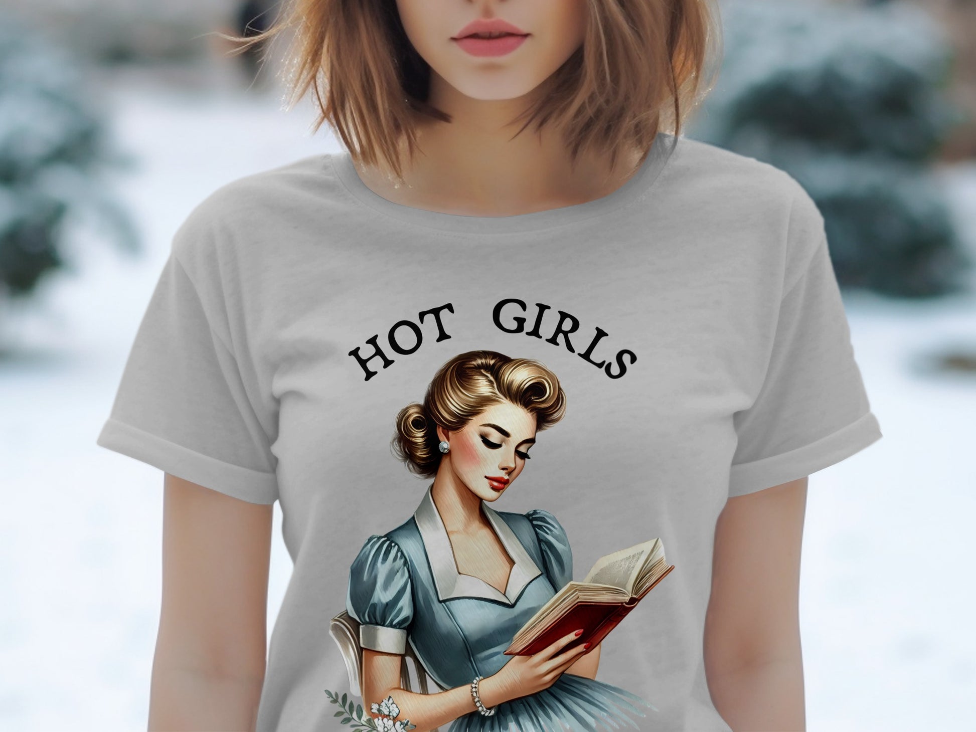 Grey t-shirt with "HOT GIRLS" text and illustration of a woman reading a book.