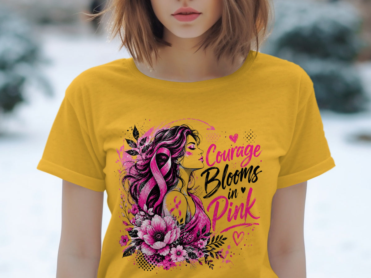 Yellow t-shirt with graphic "Courage Blooms in Pink" and woman with pink ribbon.